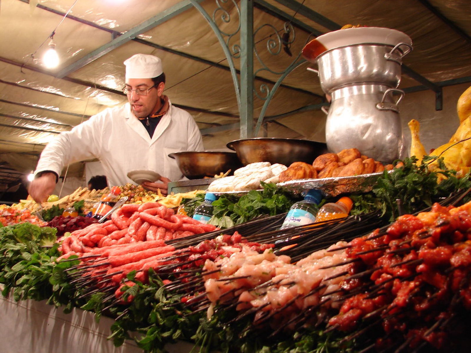 A vendor at a market stall